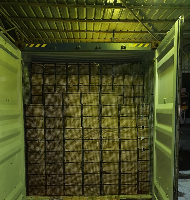 Loading of glove boxes into container